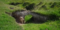 Tiny arch in clay soil